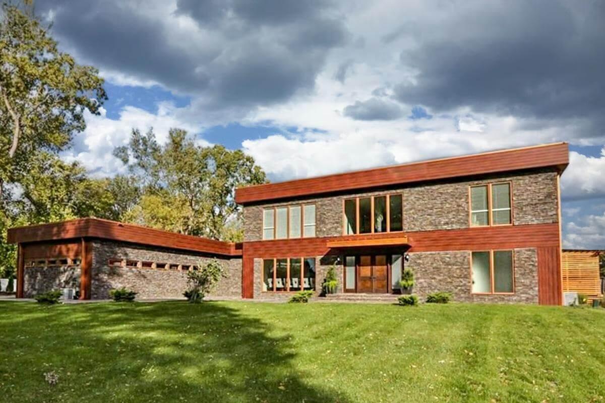Modern Home with Striking Stone Facade and Warm Wood Accents
