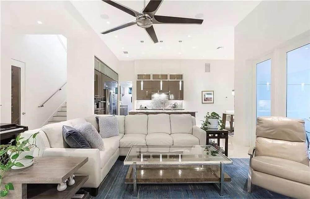 Contemporary Living Room Featuring a Striking Ceiling Fan