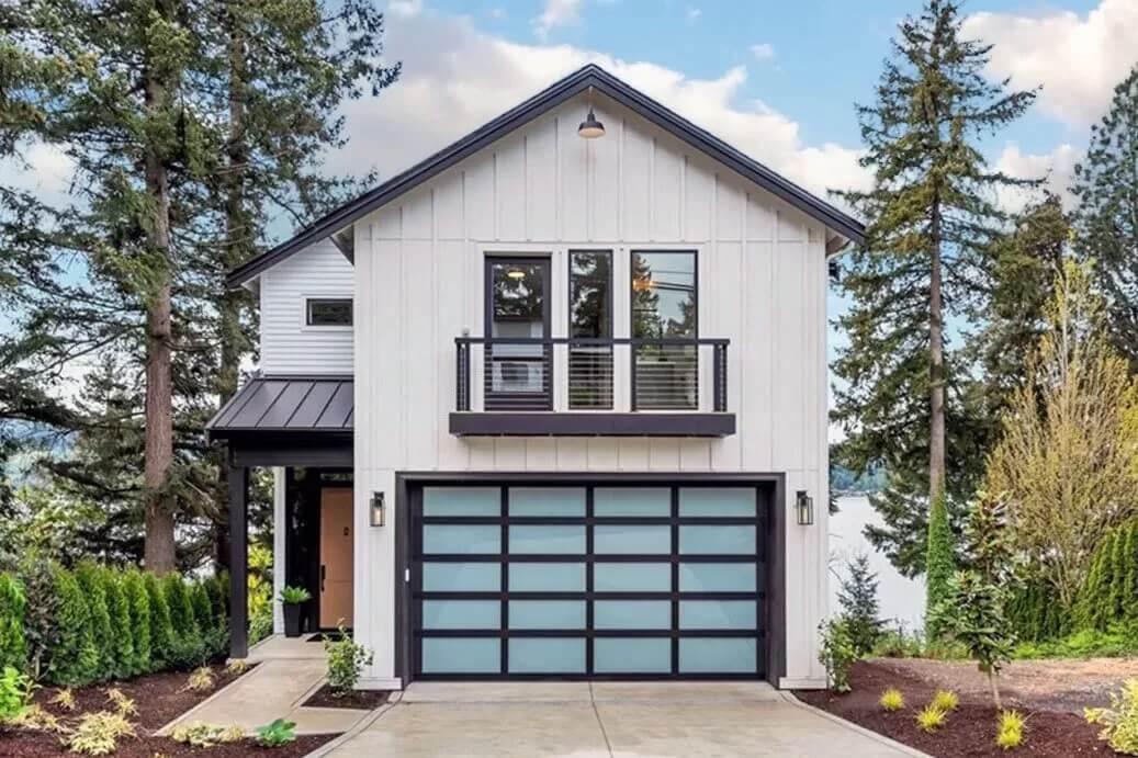 Modern Farmhouse with Striking Glass-Panel Garage Door