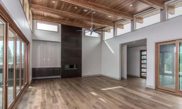 Open Living Area with Dramatic Ceiling and Abundant Natural Light