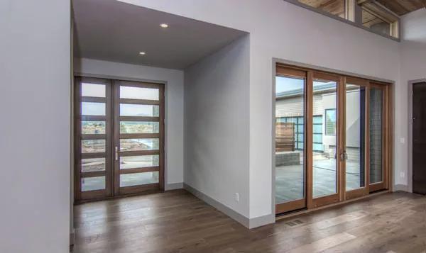 Check Out the Sleek Entryway with Expansive Glass Doors