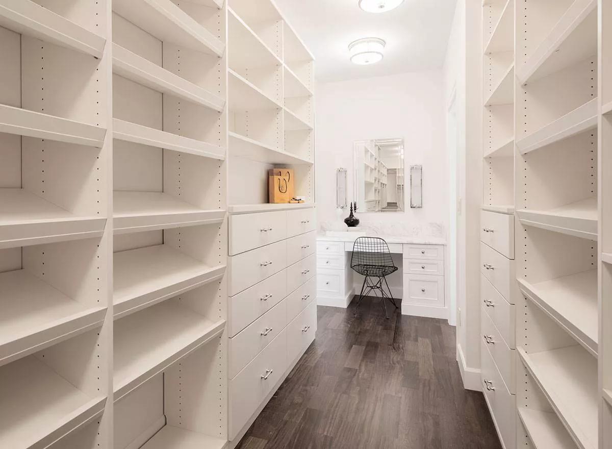 A Walk-In Closet With Clever Organization and an Elegant Dressing Table