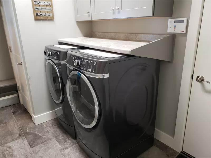Practical Laundry Setup with Stylish Countertop Space