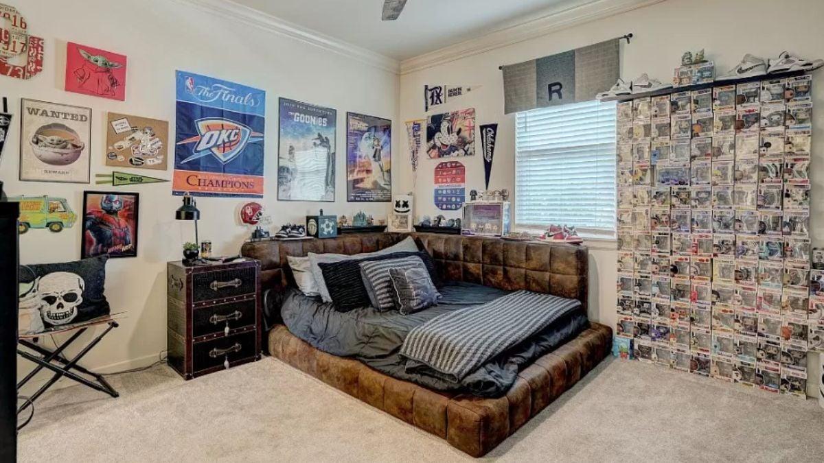 Check Out This Playful Wall of Collectibles in a Dynamic Bedroom
