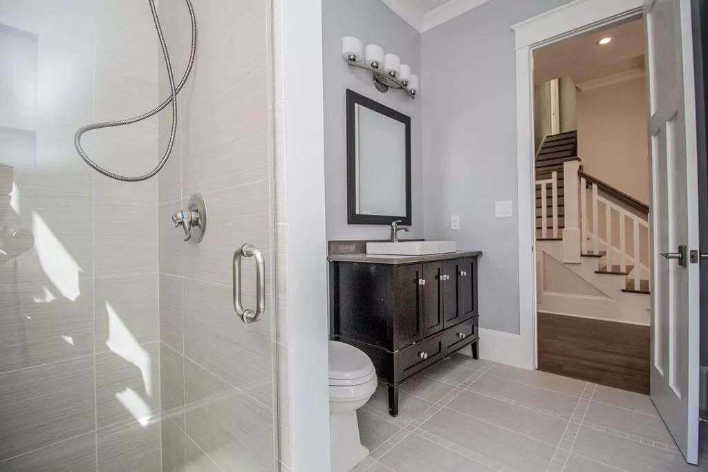 Compact Bathroom Vignette with a Tidy Vanity and Glass Shower