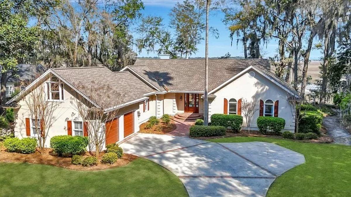 A Craftsman Gem with Rich Wooden Accents and Lush Landscaping