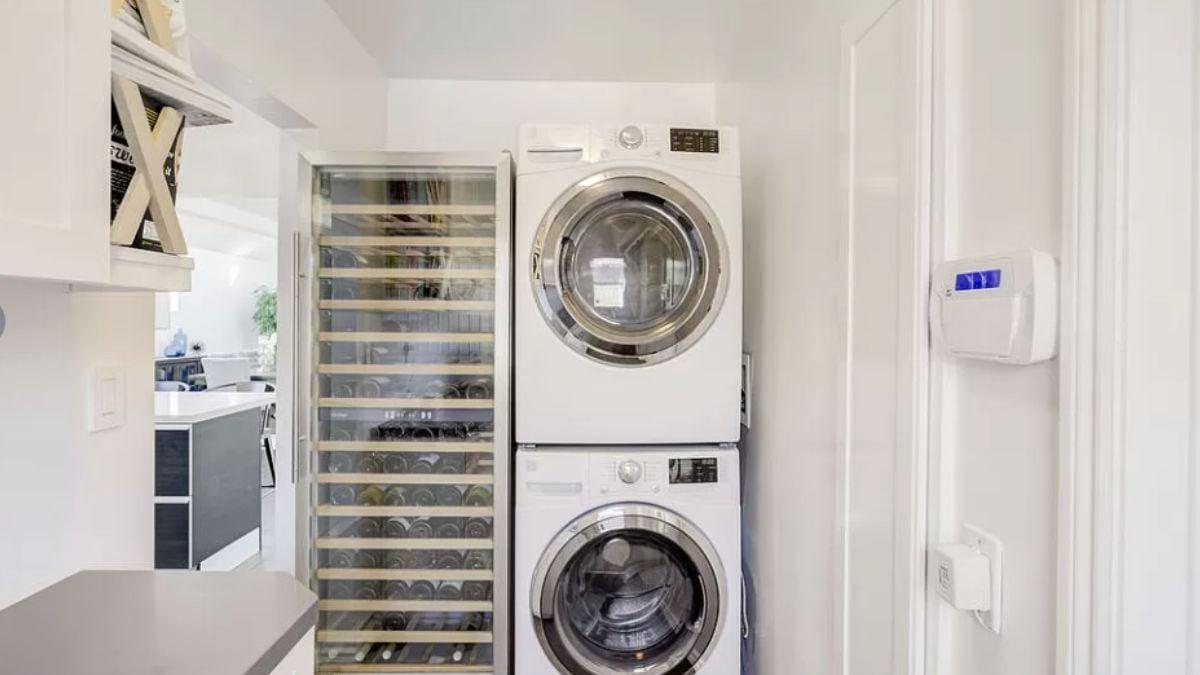 Laundry Meets Luxury With a Wine Fridge Right Beside the Stacked Washer/Dryer