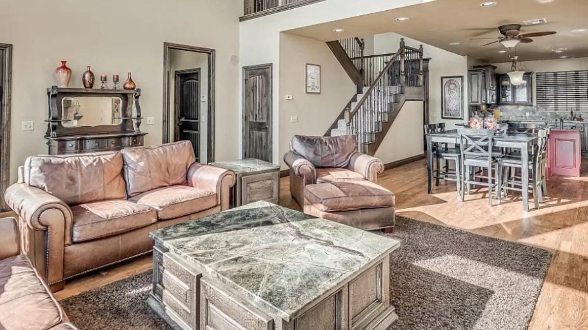 Spacious Living Room with Plush Leather and Marble Accents