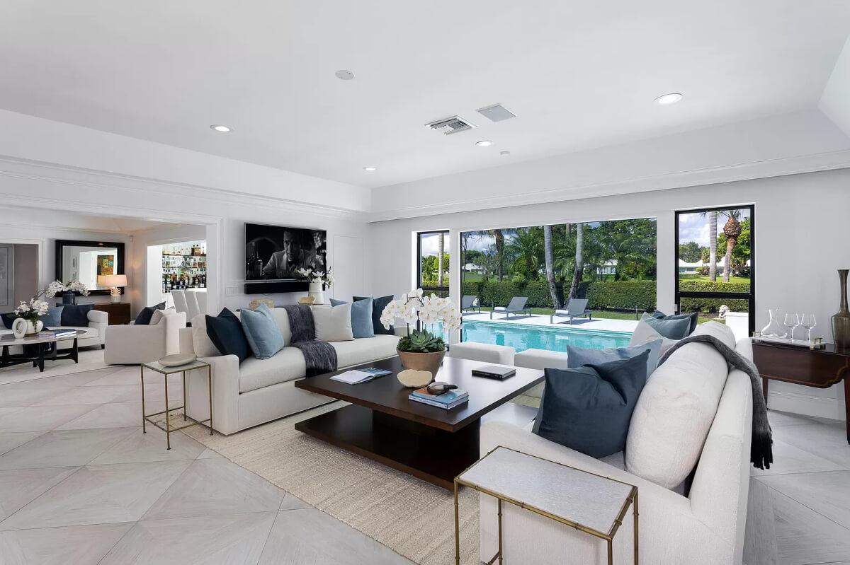 Living Room with Expansive Pool Views and Sophisticated Decor