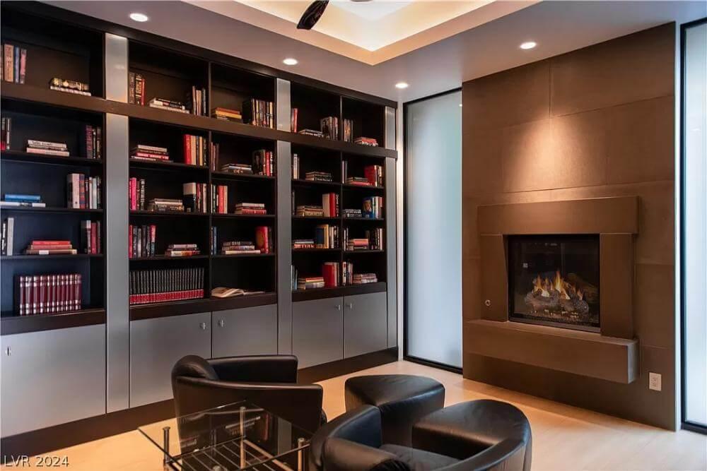 Explore This Cozy Library with a Modern Fireplace Design