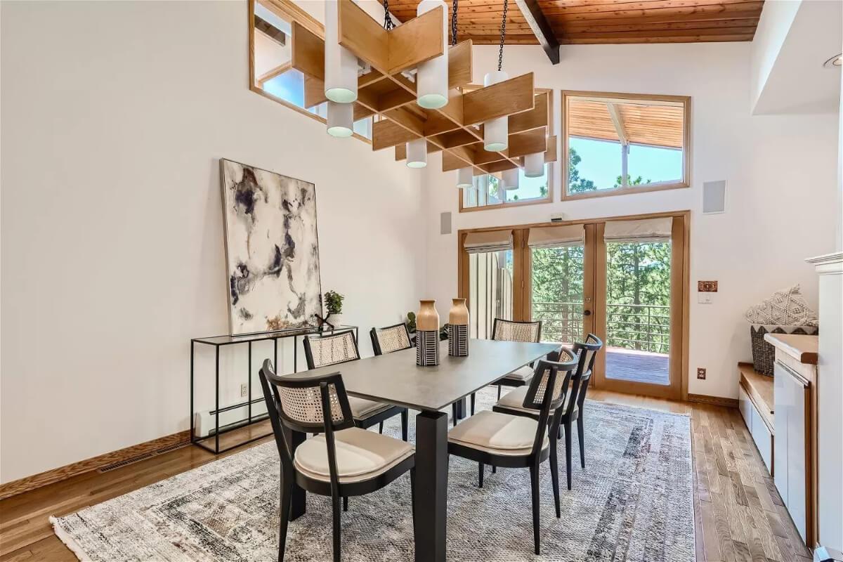Wow, Notice the Striking Wood Beam Light Fixture in This Dining Room