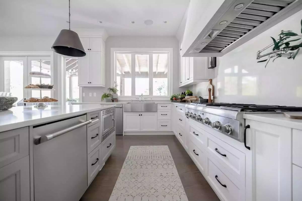 Appreciate the Practical Layout and Pendant Lighting in This Sleek Kitchen