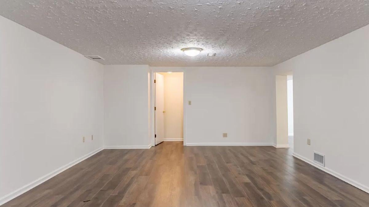 Spacious Room with Simple Ceiling Detail and Sleek Floors