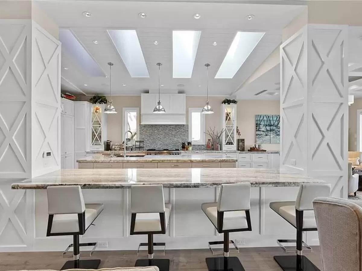 Admire the X-Patterned Cabinetry and Skylit Kitchen Ambiance