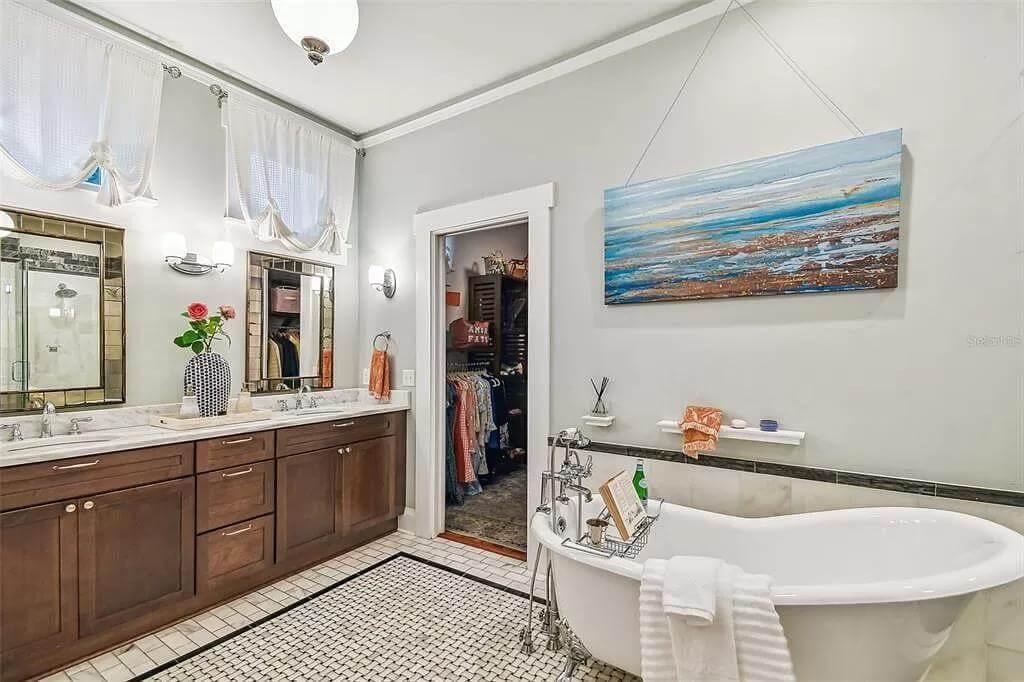 Notice the Relaxing Freestanding Tub Under the Serene Artwork
