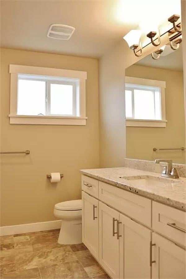 Bright Craftsman Bathroom with Clean Shaker Cabinets and Natural Light