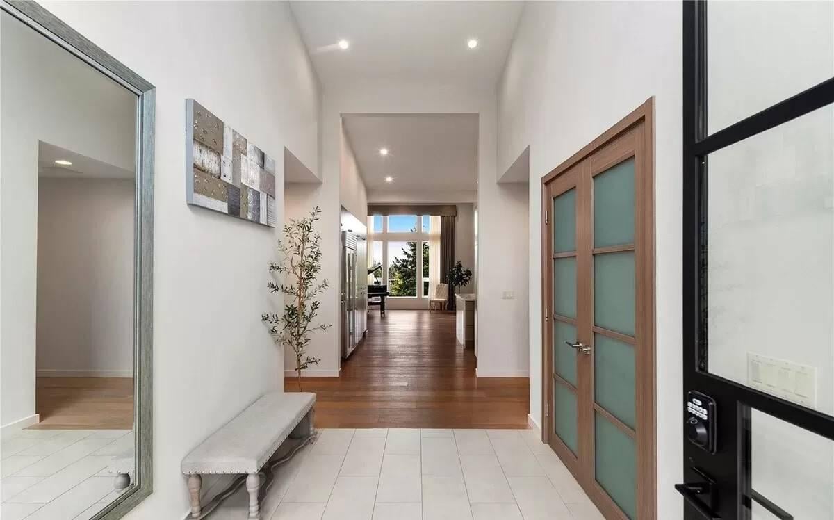 Notice the Spacious Foyer with High Ceilings and Stylish Transom Door