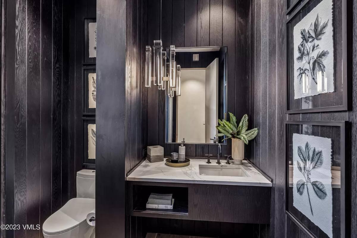 Dive Into This Chic Powder Room With Dramatic Dark Walls
