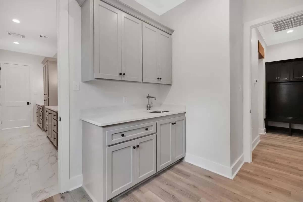 Look at This Smartly Designed Utility Room with Gray Cabinets