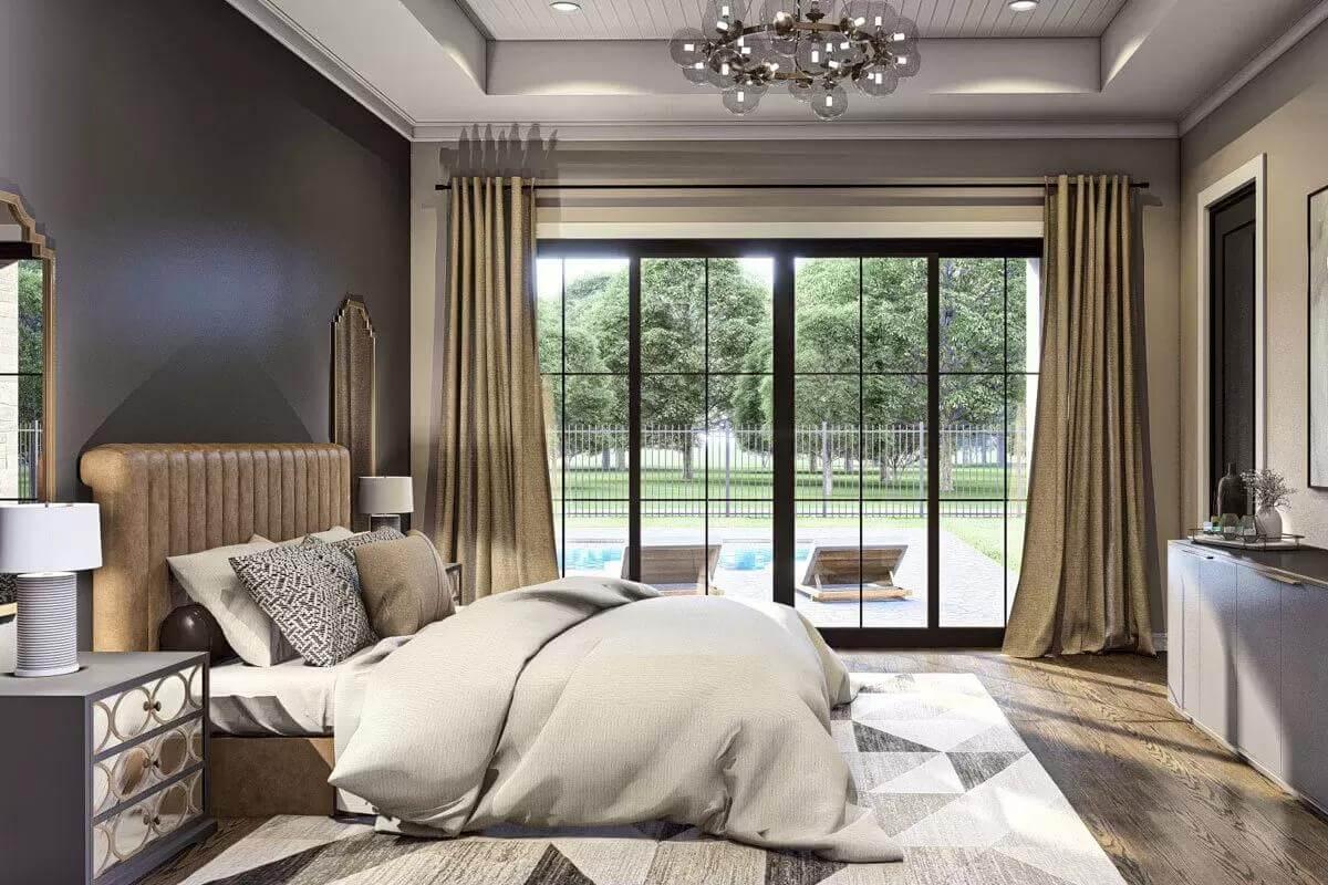 Spacious Bedroom with Poolside Views and a Luxurious Chandelier