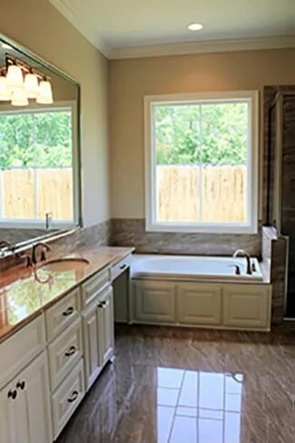Bathroom Elegance with a Spacious Counter and Inviting Tub