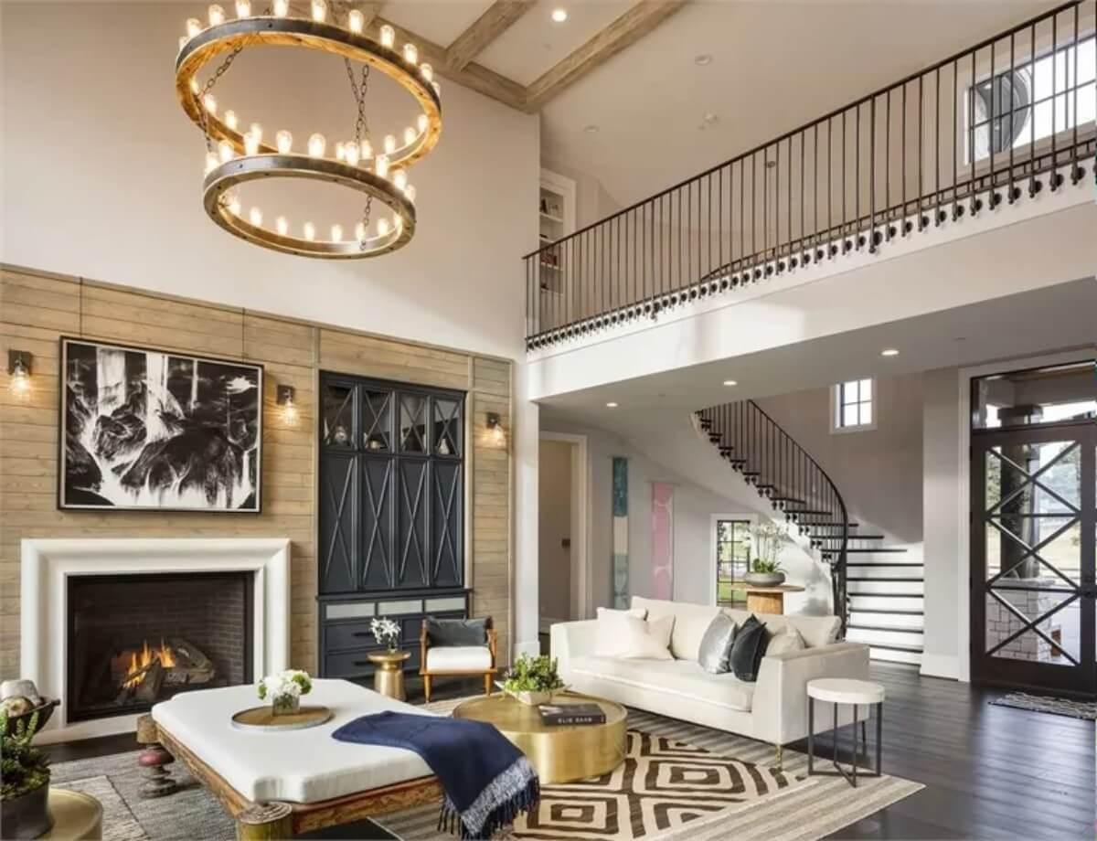 Notice the Drama of This Two-Story Living Room with a Spiraling Staircase