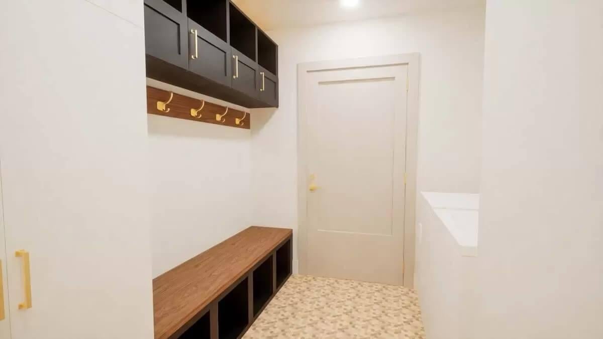 Mudroom Details: Black Cabinets and Bold Brass Hooks