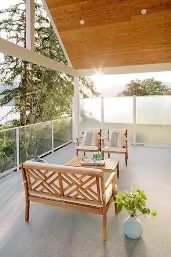 Bask in This Relaxing Patio with Expansive Wood Ceiling