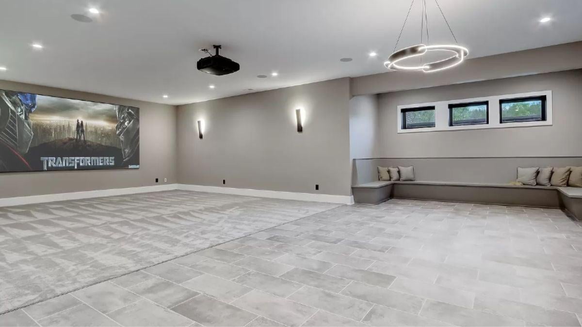 Home Theater Room with Minimalist Seating and Statement Lighting