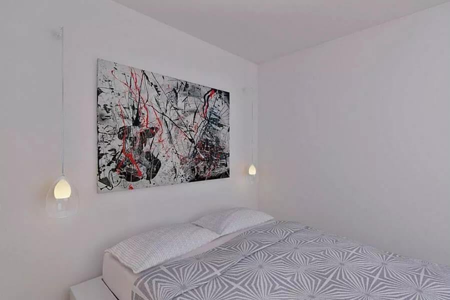 Minimalist Bedroom with Striking Pendant Lights