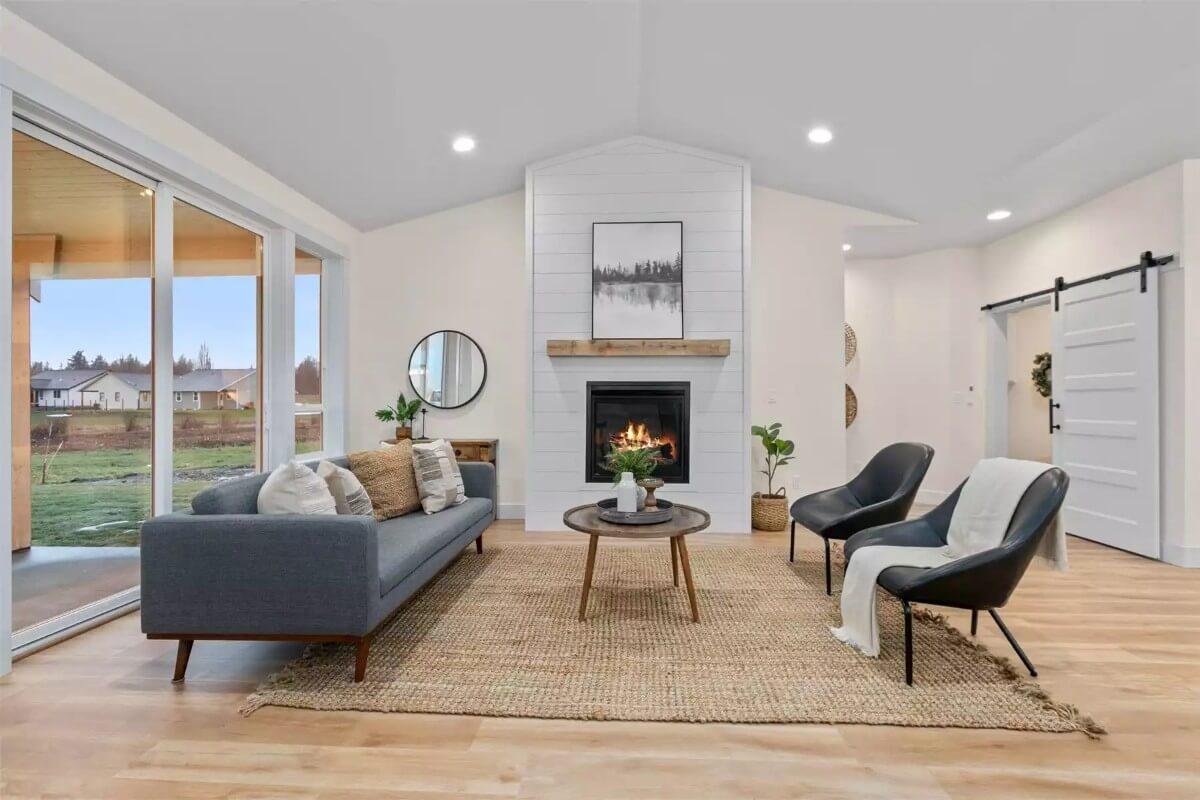 Modern Living Room with Shiplap-Accented Fireplace and Sliding Barn Door