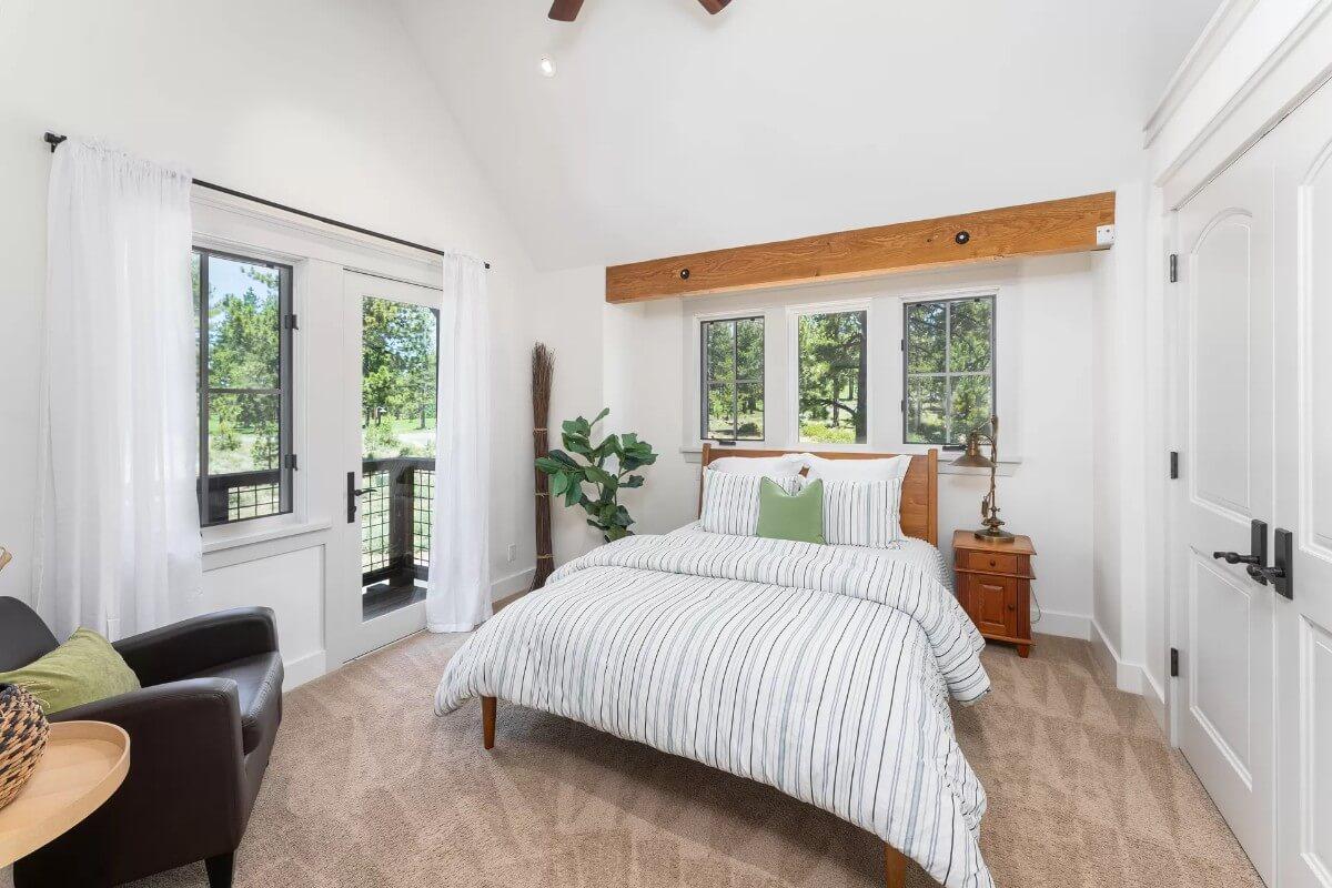 Look at the Vaulted Ceilings and Cozy Balcony in This Bedroom