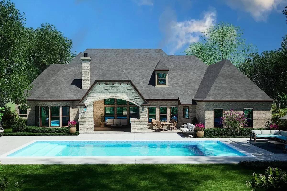 Notice the Elegant Arched Patio Overlooking the Spacious Pool