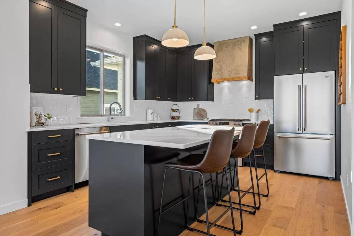 Sleek Kitchen Design with a Striking Matte Black and Brass Combo