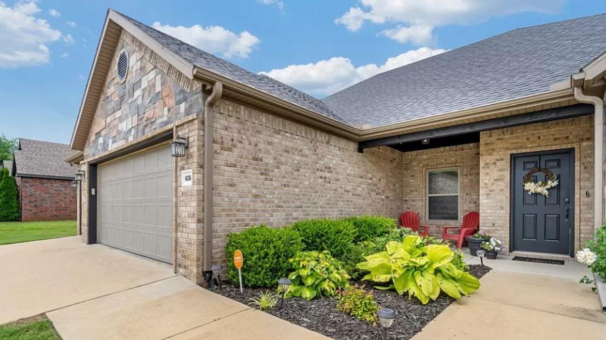 Spacious Front Porch with Classic Adirondack Chairs
