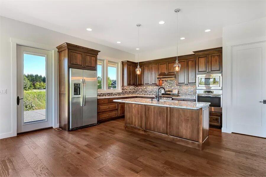 Look at That Sleek Island Balancing Warmth and Utility in This Kitchen