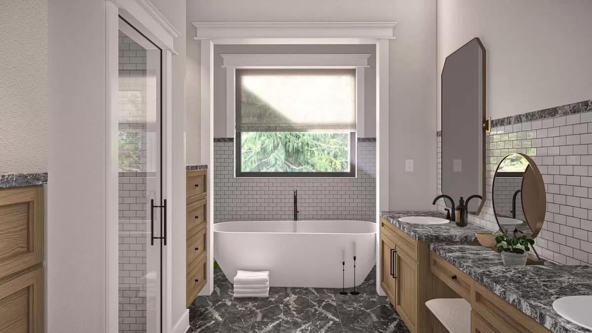 Freestanding Tub Overlooking Nature Creates a Serene Bathroom Oasis