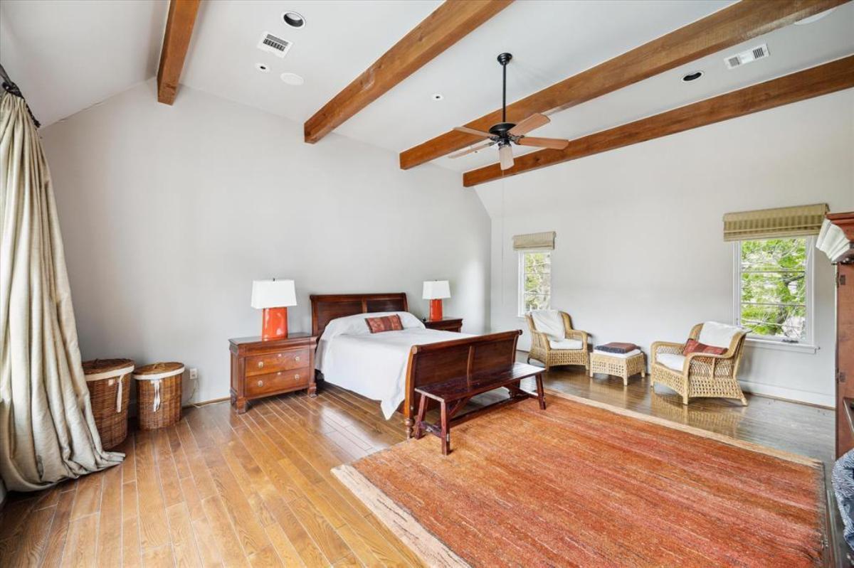 Appreciate the Rich Wood Beams in This Inviting Bedroom Retreat