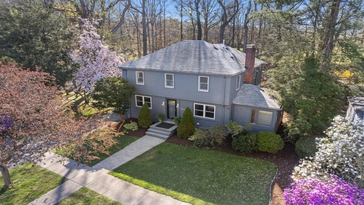 Classic Colonial Home Nestled Among Blooming Trees