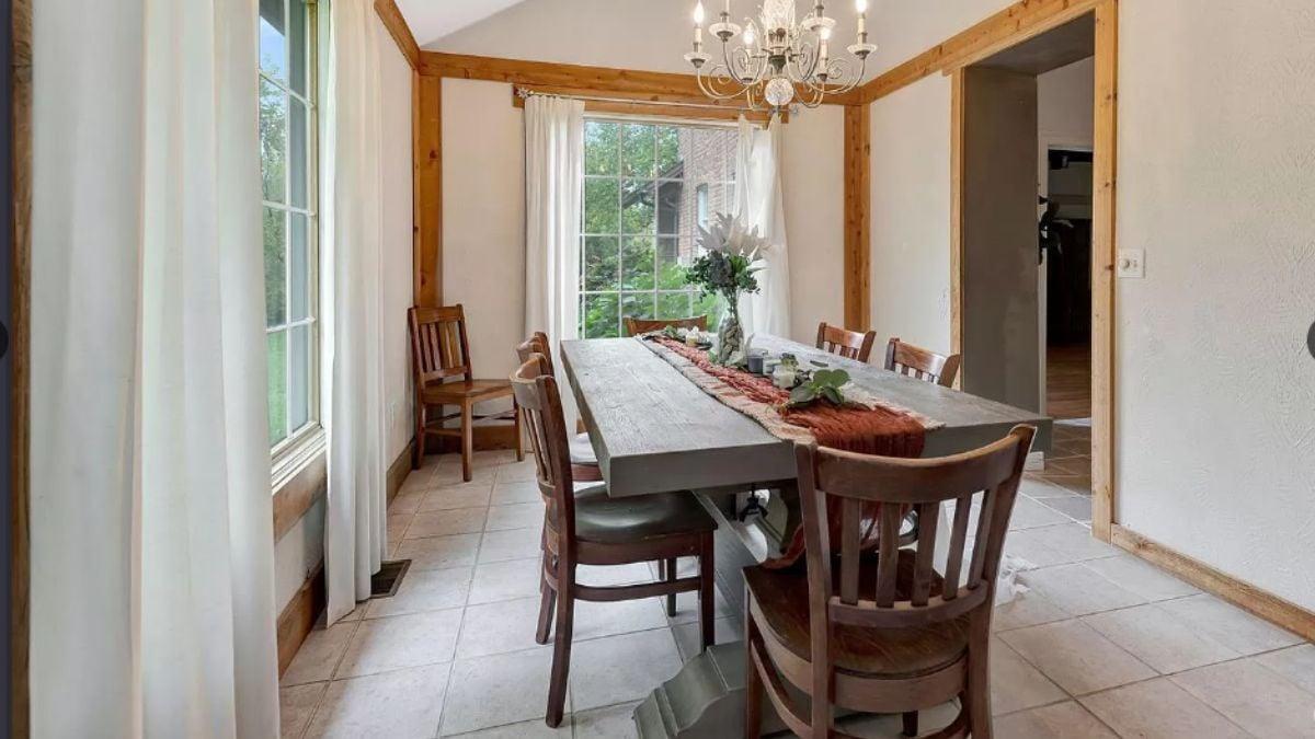 Rustic Dining Room with an Elegant Chandelier