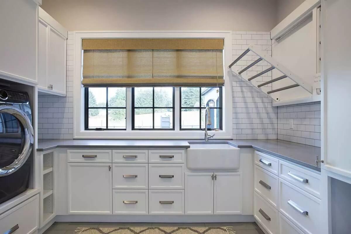 Check Out This Ingenious Fold-Down Drying Rack in the Laundry Room