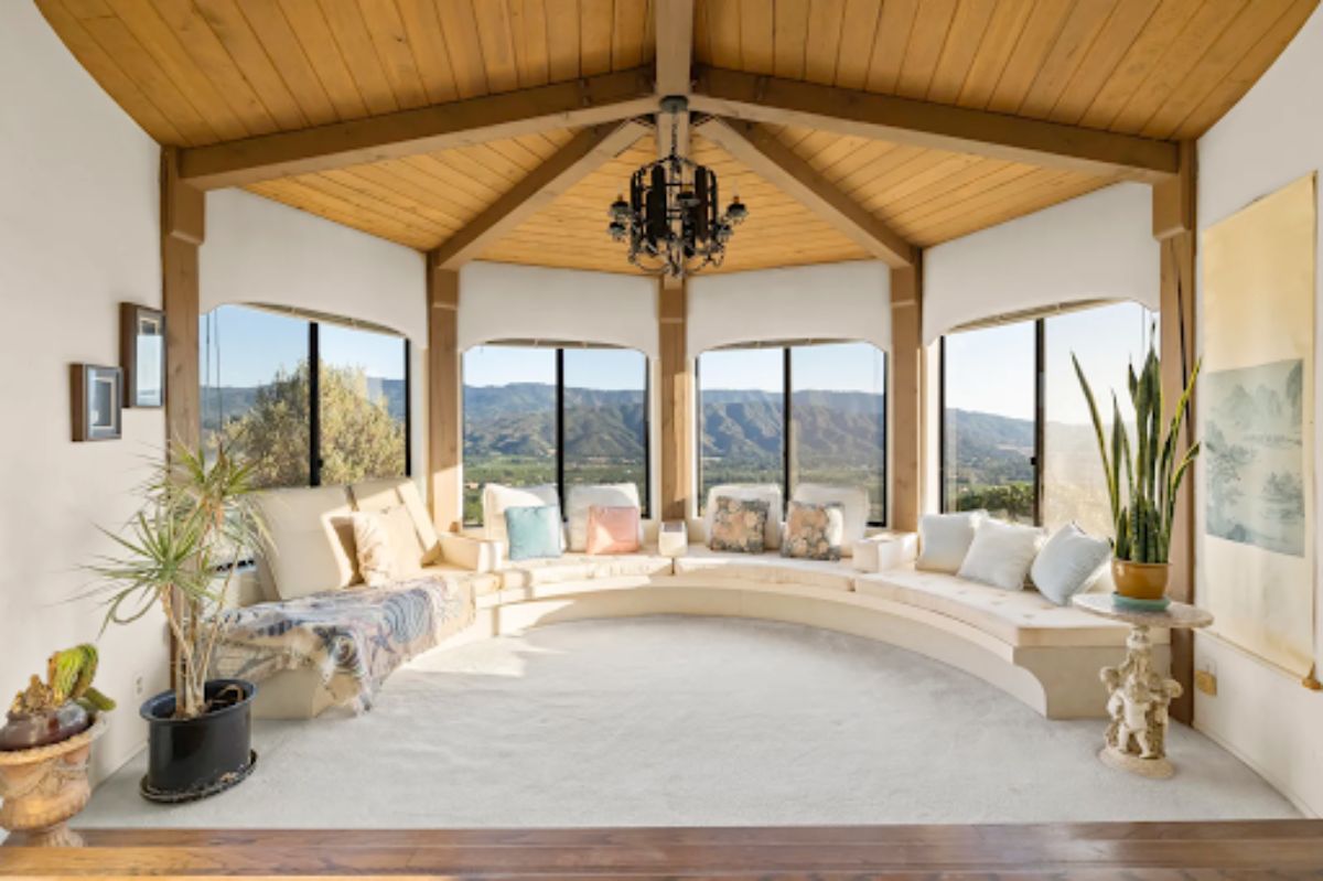 An intimate seating area that includes a custom circular bench seating and views of the surrounding mountains.