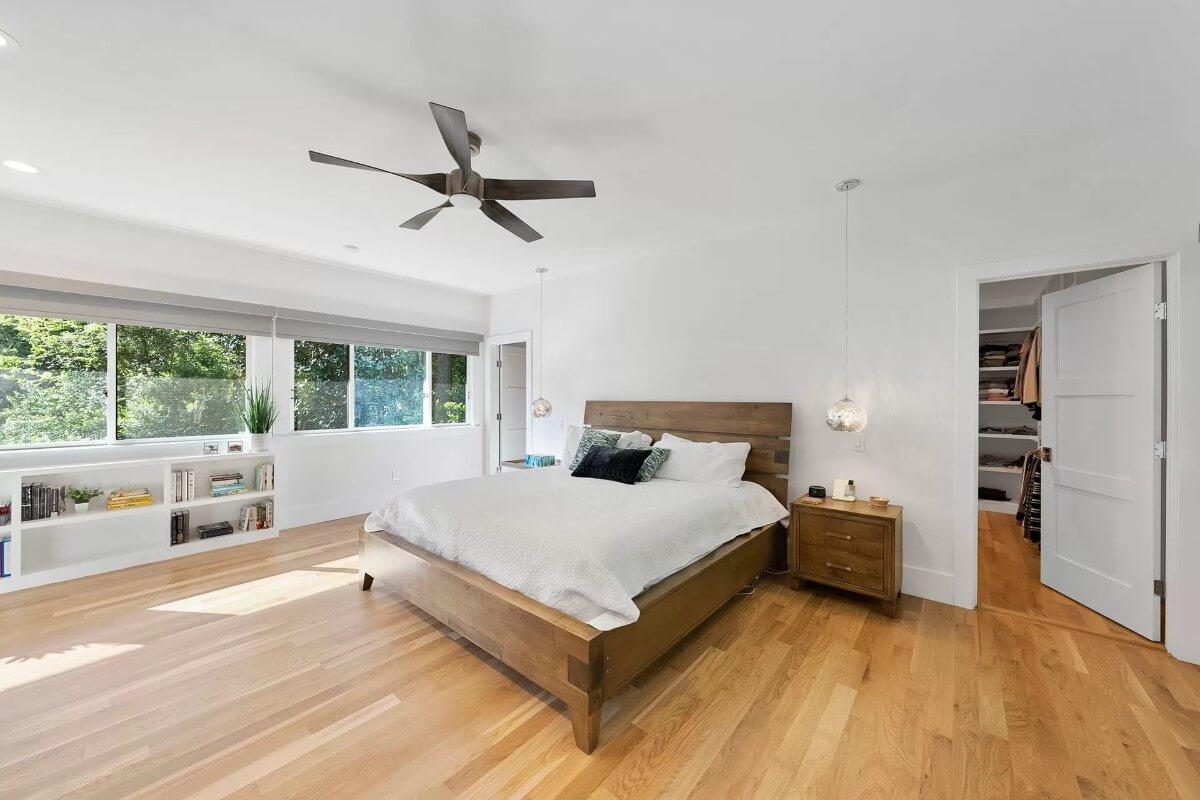 Notice the Subtle Floating Shelves Under the Expansive Window