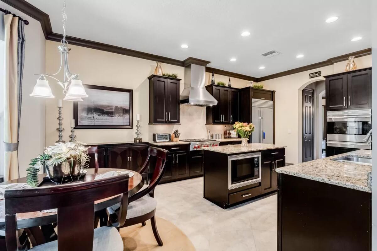 Look at the Contrast of Dark Cabinets and Light Countertops in This Kitchen