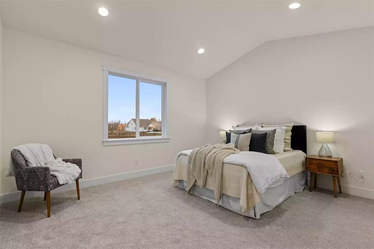 Minimalist Bedroom with a View and Cohesive Textures