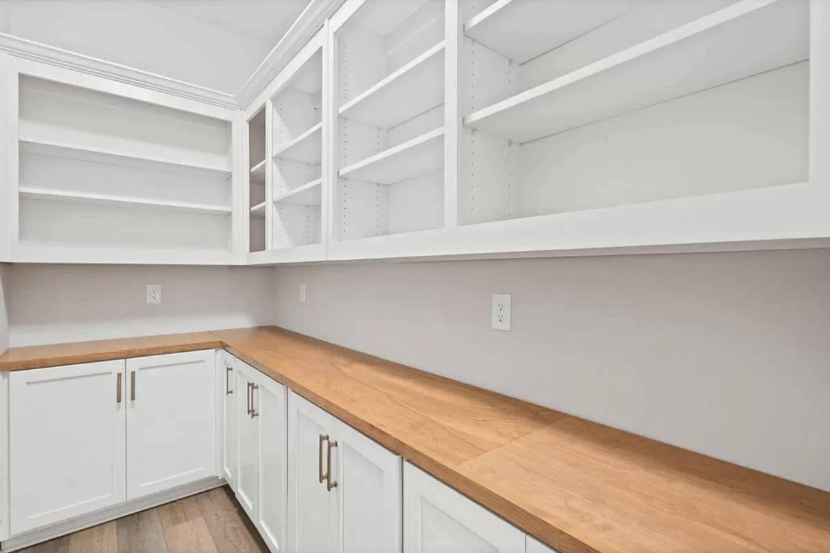 Admire the Open Shelving and Wooden Counters in This Stylish Pantry
