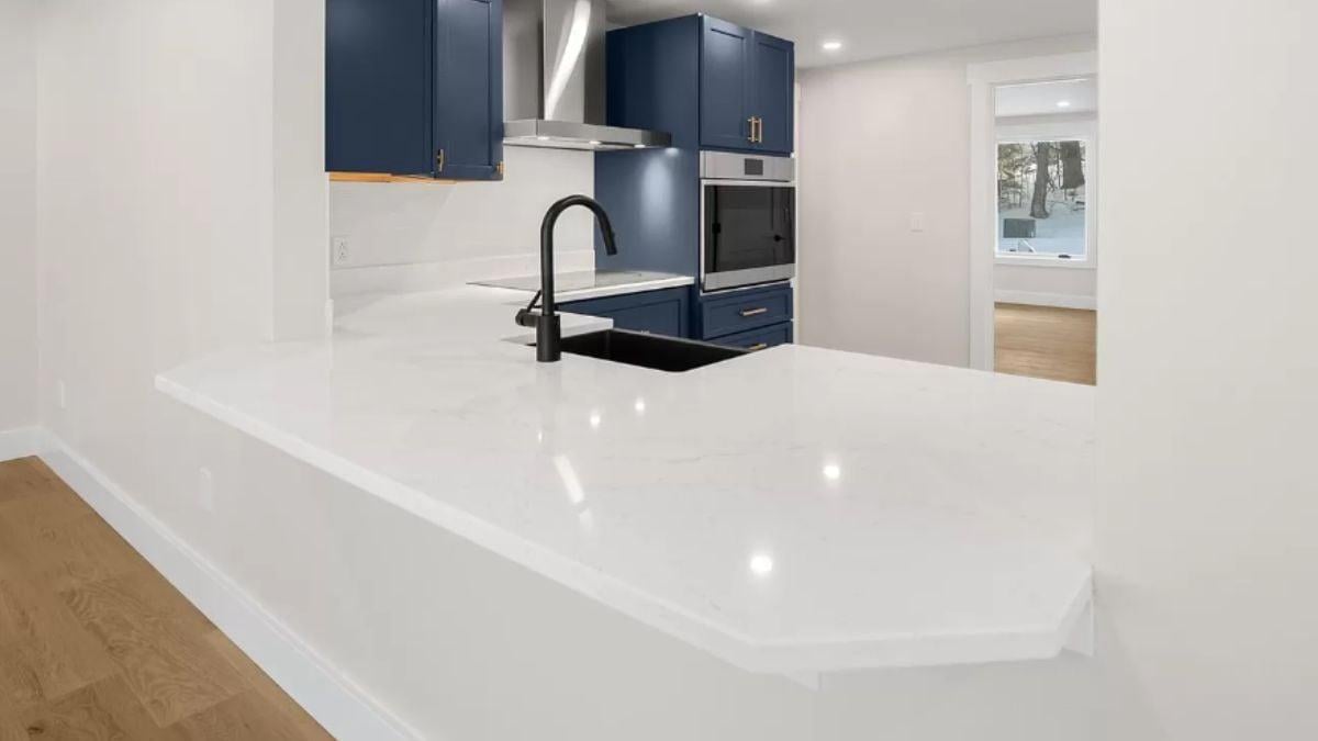 Bold Blue Cabinets and Black Hardware Make This Kitchen Stand Out