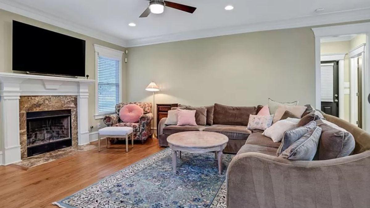 Cozy Living Space with a Plush Sectional and Elegant Fireplace