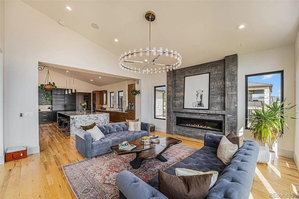 Chic Living Area with a Stunning Fire Feature and Open Kitchen