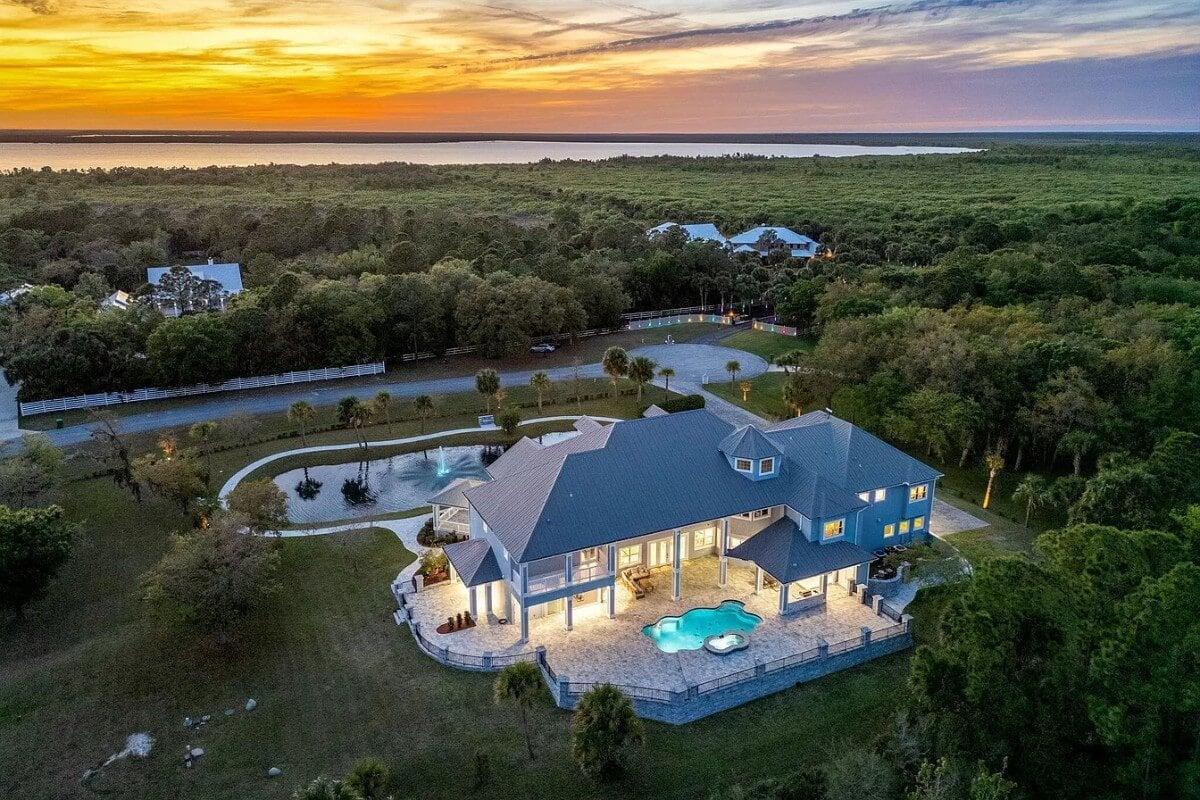 Dive Into the Luxury of This Illuminated Poolside Retreat at Sunset